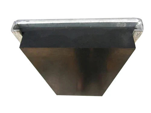 Wedge-shaped rubber dock bumper seen end-on, tapered sides under a galvanised steel cap strip