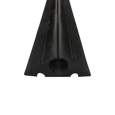 Angled end-on view of the ribbed black protector showing the circular cable bore and notched base