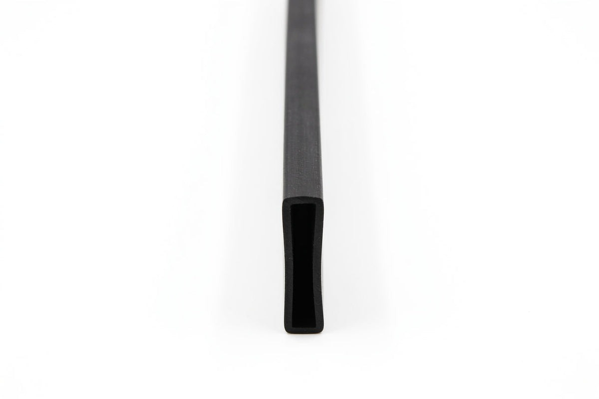 Rectangular rubber strip shown end-on with a slotted U-shaped channel profile