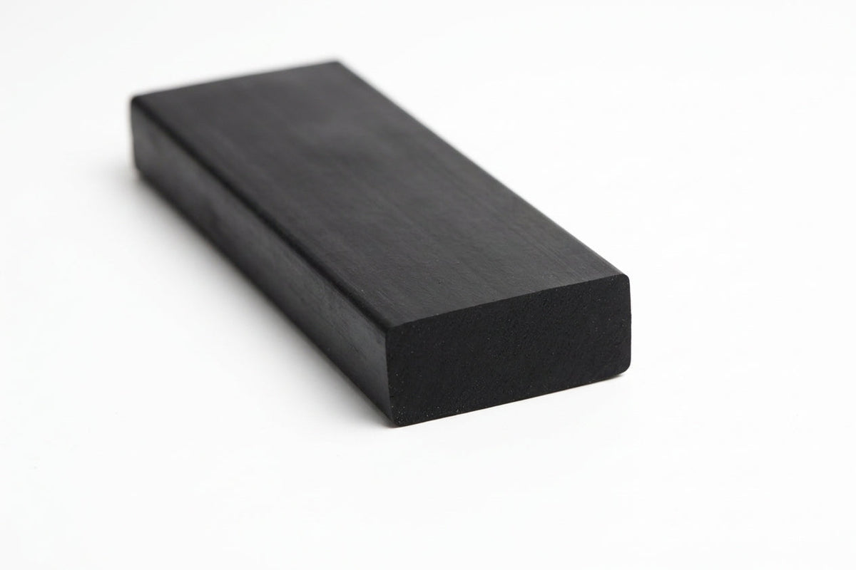 Black rectangular rubber strip shown at an angle, thick flat block profile