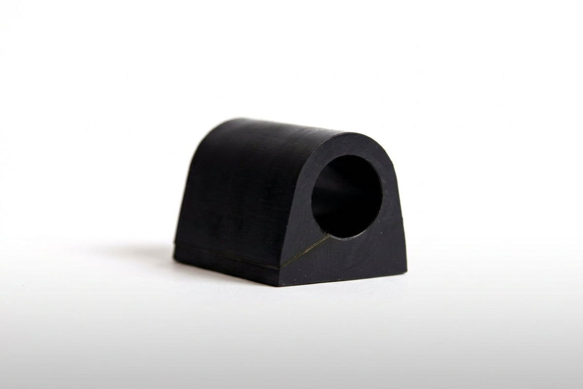 Black rubber anti-roll bar bush, studio shot on white background