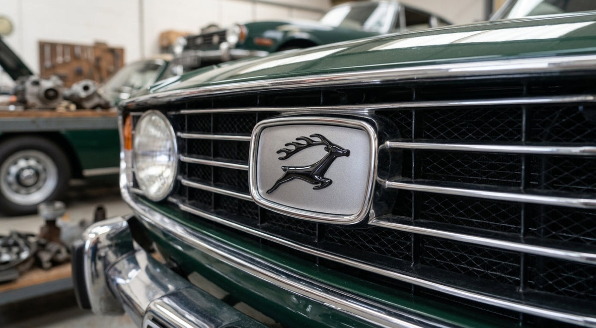 Leaping stag grille badge fitted between the headlights of a green Triumph Stag Mk1