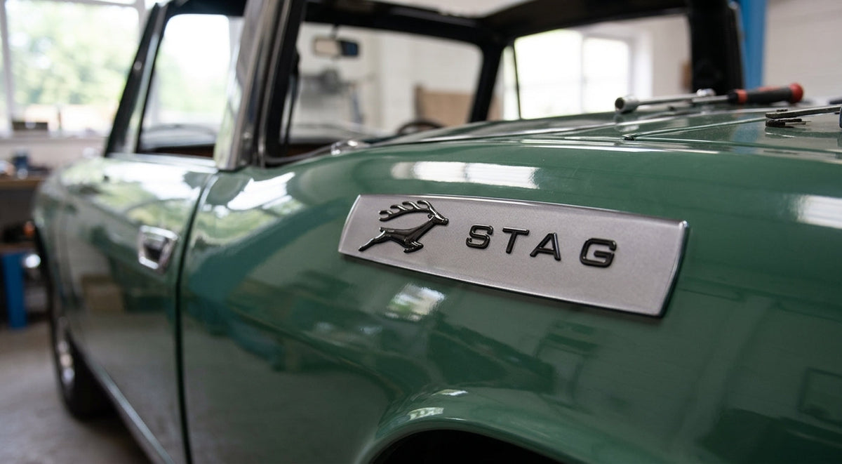 Silver STAG side badge fitted to the wing of a green Triumph Stag Mk1