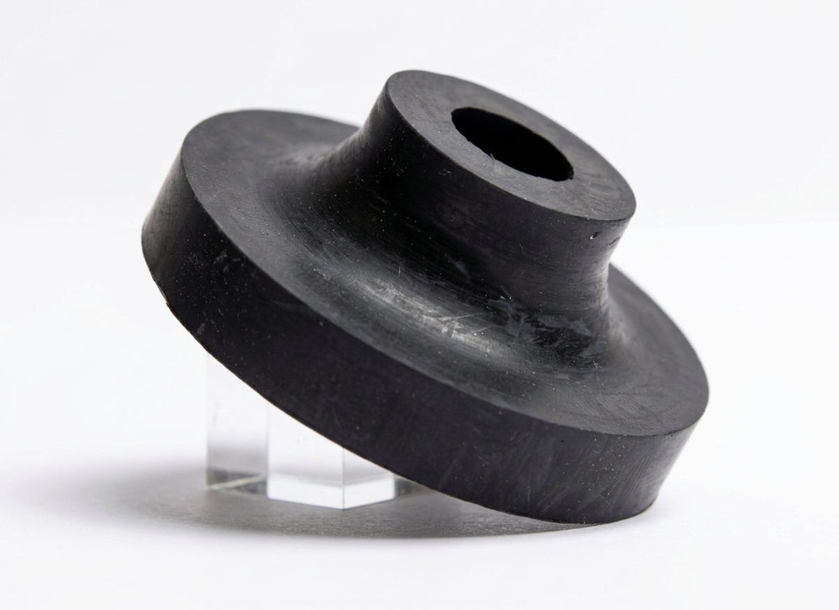 Black rubber mounting bush on a clear stand, studio white background