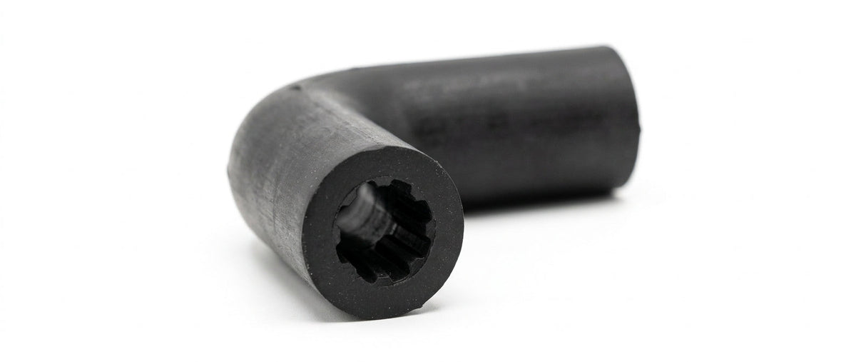 Black ribbed rubber elbow connector, studio shot showing bent profile