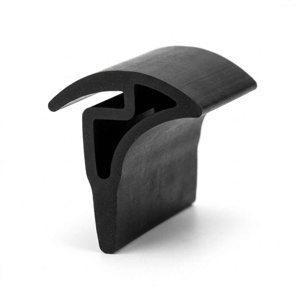 Black silicone sink seal length shown at an angle, winged trim-cap profile