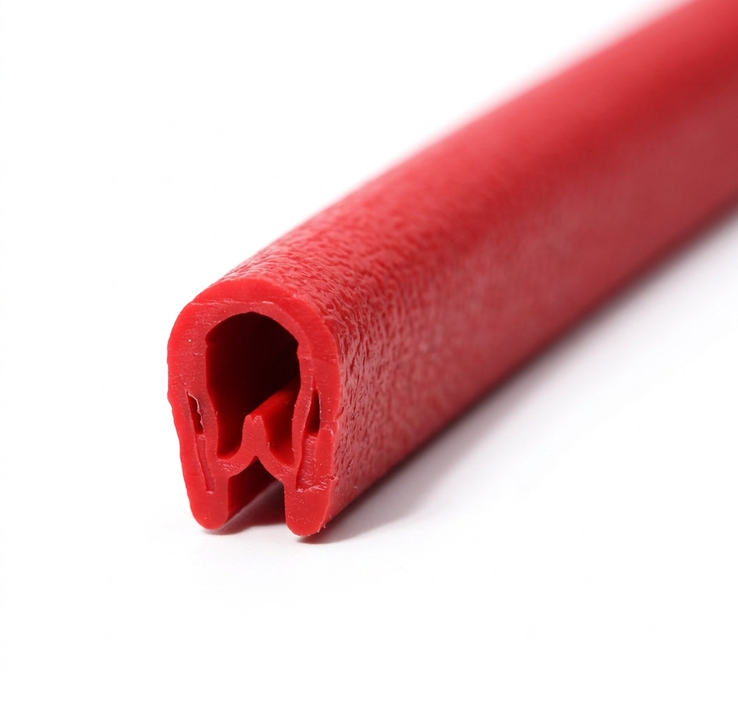 Cut length of glossy red PVC edging strip shown end-on with the metal-lined grip visible