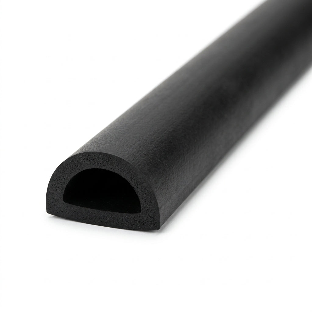 Coiled length of black rubber D-section profile with hollow half-round bore