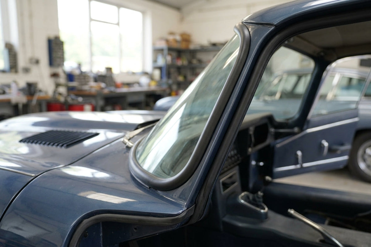 A-post seal fitted to a dark blue classic Jaguar's windscreen pillar