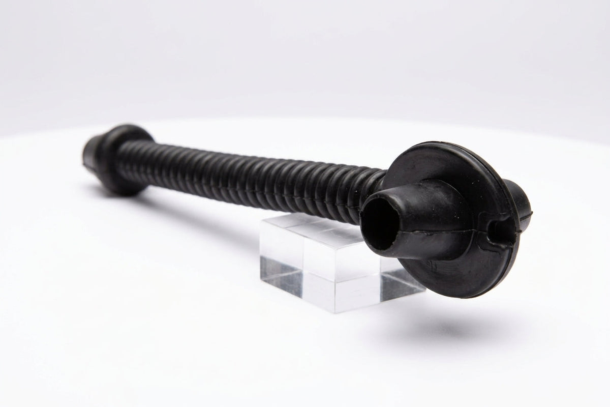 Black ribbed tailgate grommet with two round end caps, on a stand