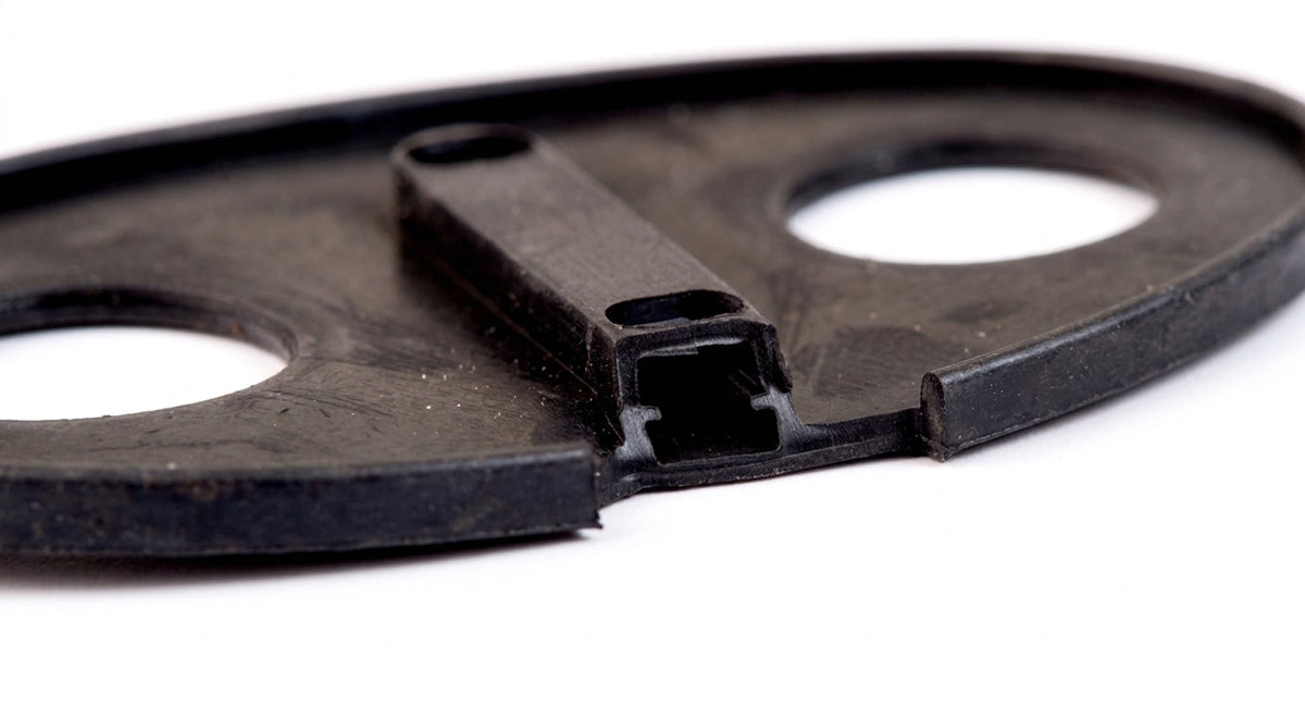 Black oval door striker gasket with twin holes, studio shot