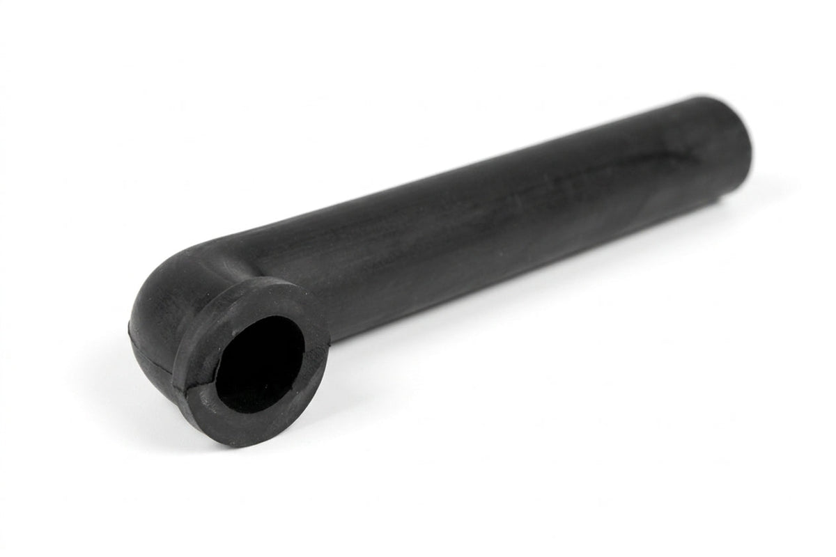 Black rubber drain pipe moulding with an angled end, studio shot