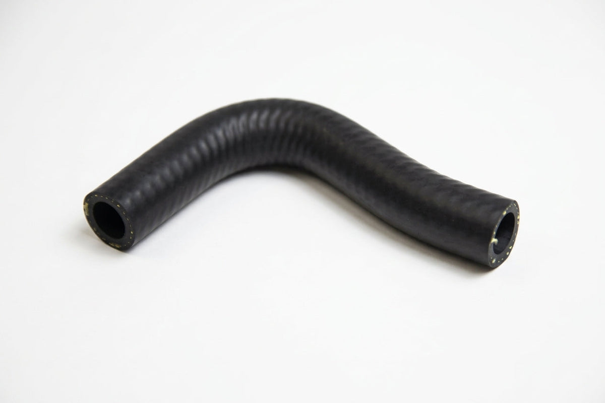 Curved black ribbed heater hose on a plain white background, studio shot