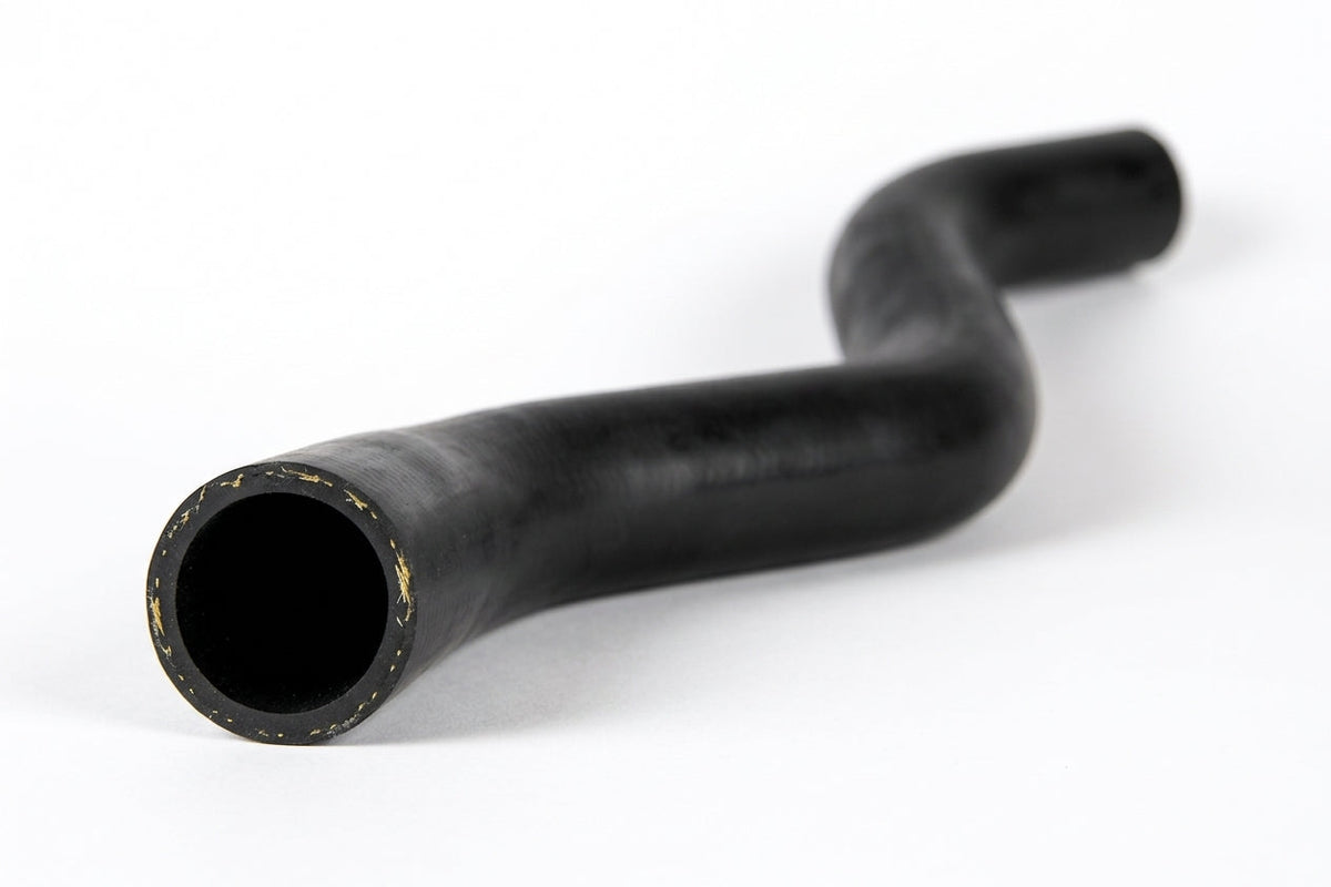 Black radiator top hose with S-shaped bend, studio shot on white
