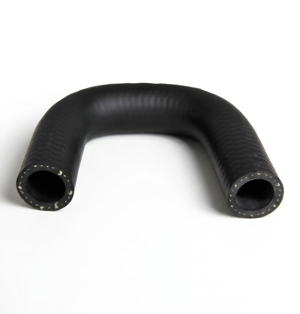 Black ribbed hose bent in a tight U, Kevlar reinforcement threads visible at both ends