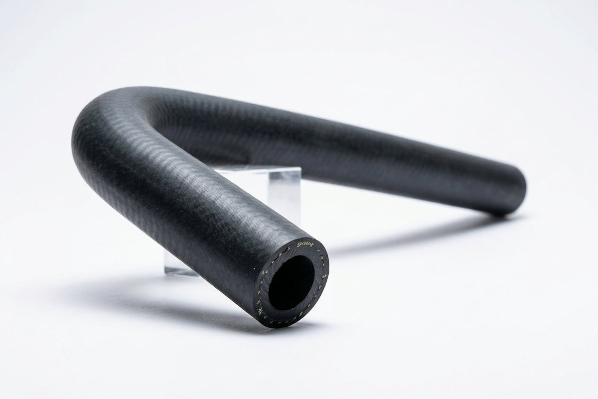 Black heater return hose curved into a loop, studio shot on stand