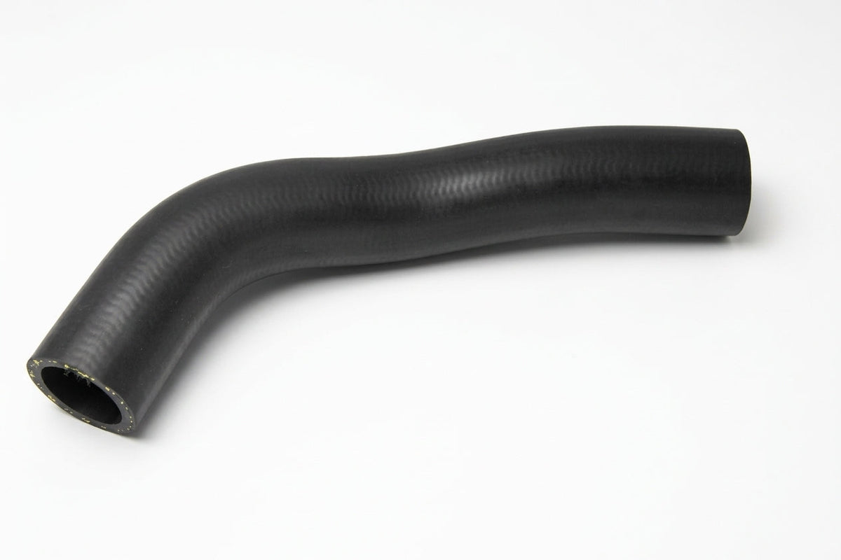 Curved black rubber top radiator hose, studio shot on white background