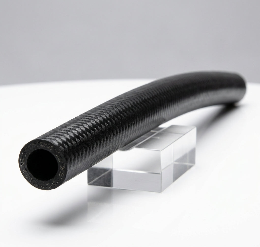 Black textured heater feed hose with gentle curve, studio shot on stand