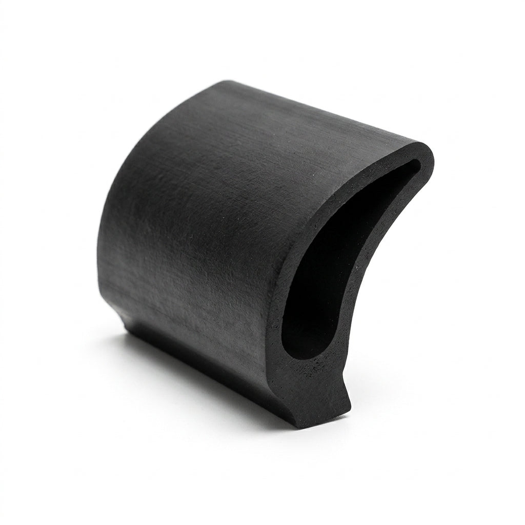 Curved black rubber J-shaped sill seal, angled studio shot on white background