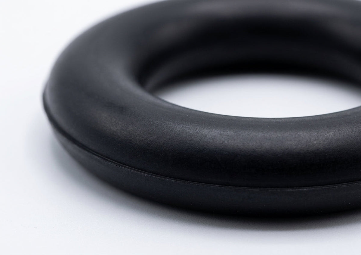 Black rubber exhaust mounting ring, close-up studio shot showing the torus profile