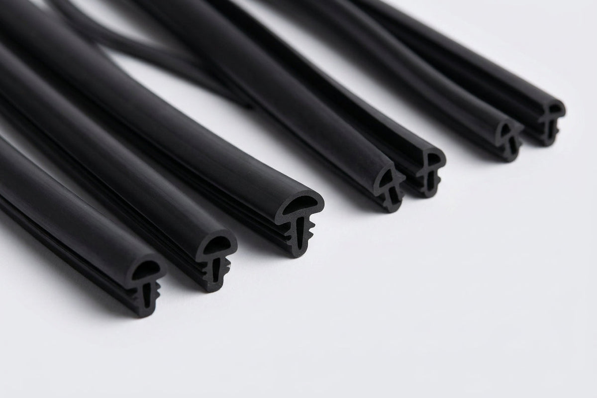 Several black rubber beading lengths fanned out on white background