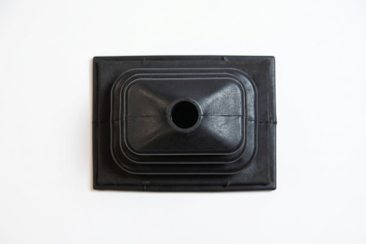 Black rectangular rubber gear gaiter viewed from above, studio shot