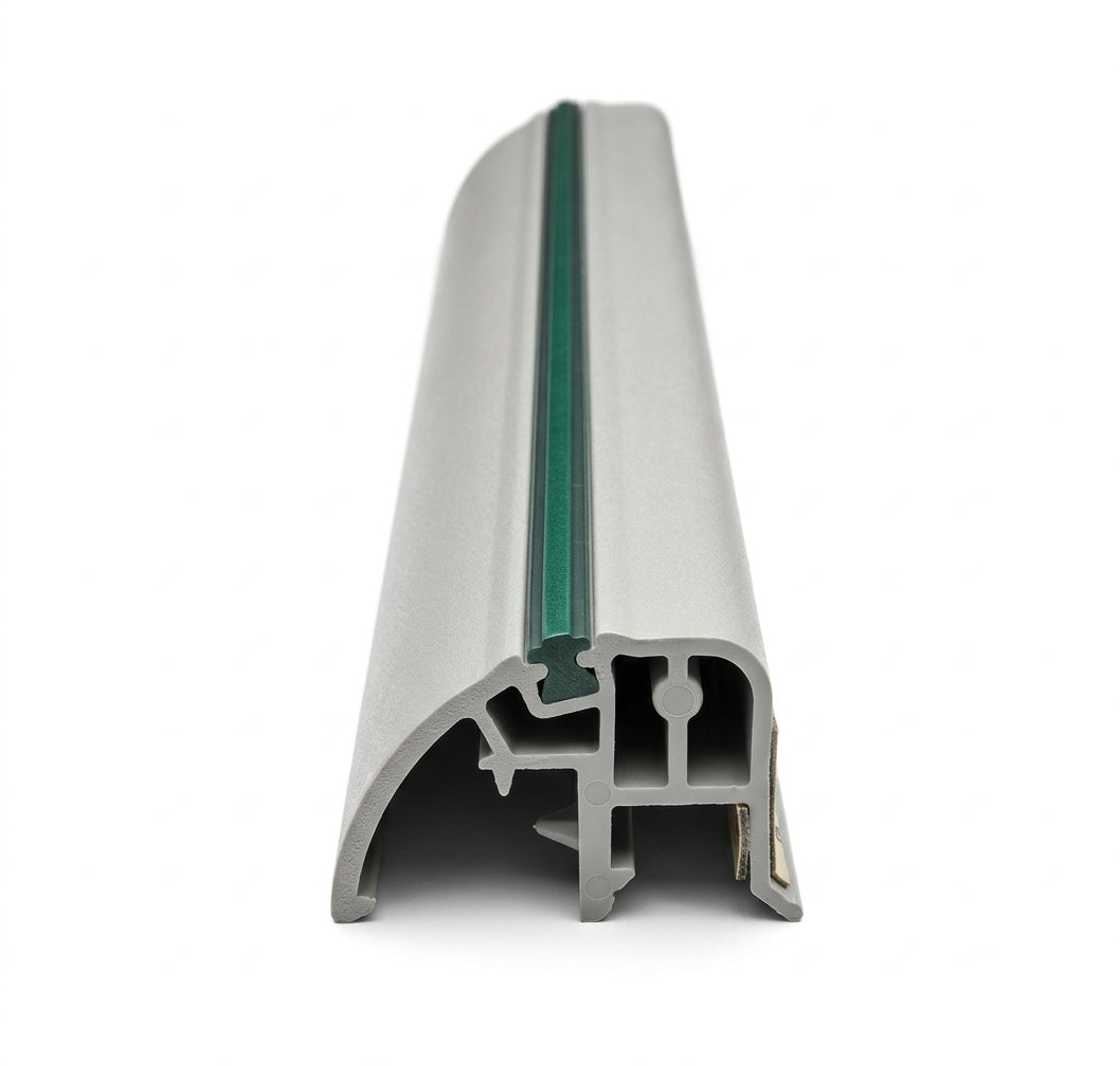 Silver-grey door moulding profile with green centre insert, front-on studio shot