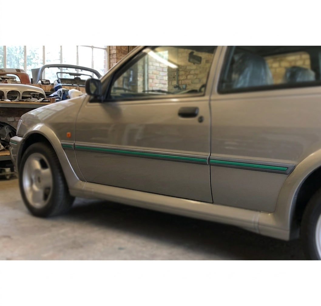 Grey moulding with green insert running along the doors of a silver Fiesta Mk3 RS Turbo