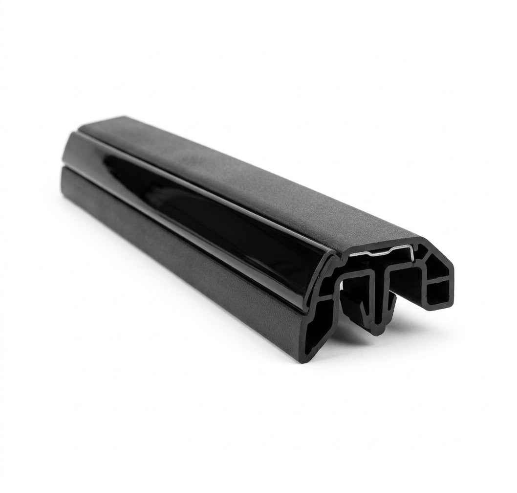 Black door moulding profile with glossy insert channel, angled studio shot