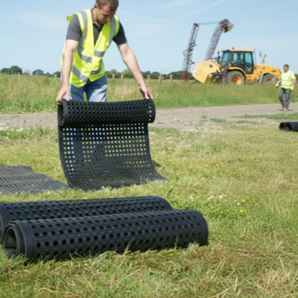 Grass growth friendly rubber mat for pathways and erosion control