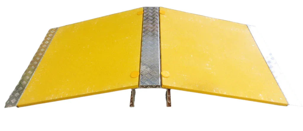 Front-on product shot of the two-wing yellow ramp with chequer-plate centre spine and open tunnel beneath