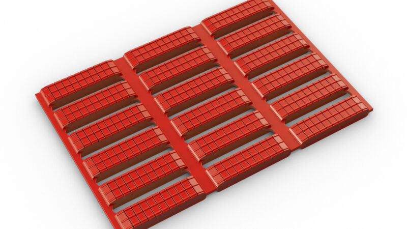 Red modular anti-fatigue matting showing drainage slots and non-slip textured surface, ideal as a hygienic floor mat for commercial wet areas.