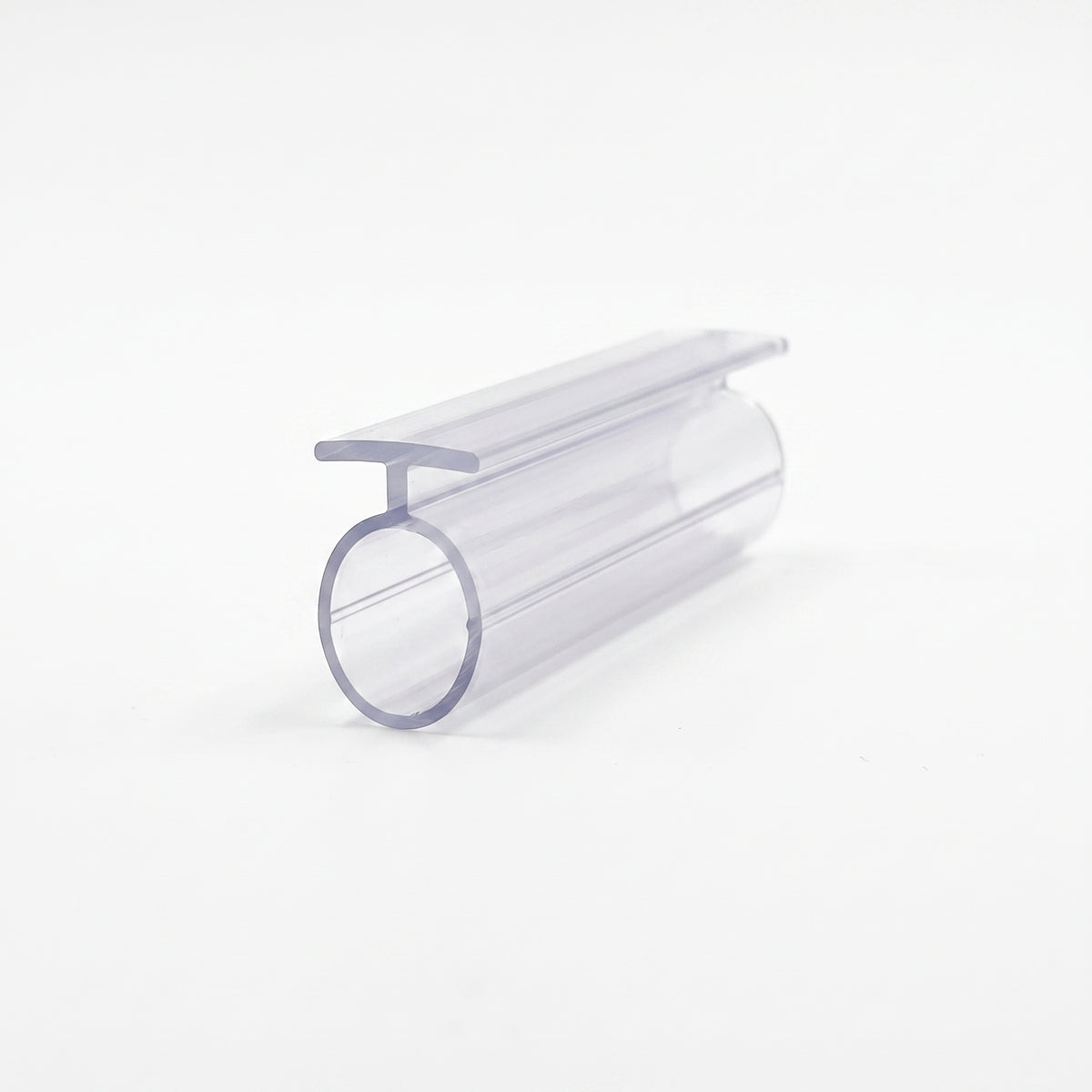 Clear seal offcut angled on white, wide flat T-head along the top of a large hollow round tube
