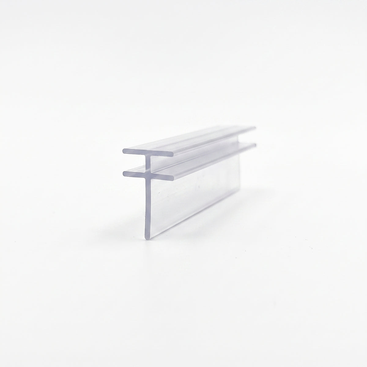 Clear seal offcut on white, F-shaped section with a side flange above a long straight blade