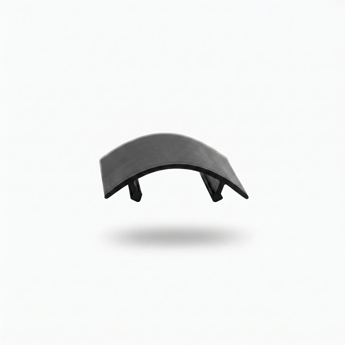 Short offcut of the black upright seal on white, arched membrane with two T-head ribs beneath, seen end-on