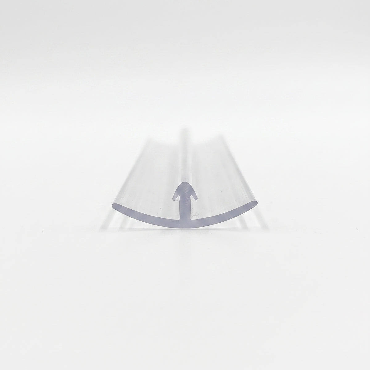 Clear seal end-on on white, shallow curved skirt with a single arrowhead barb at its centre