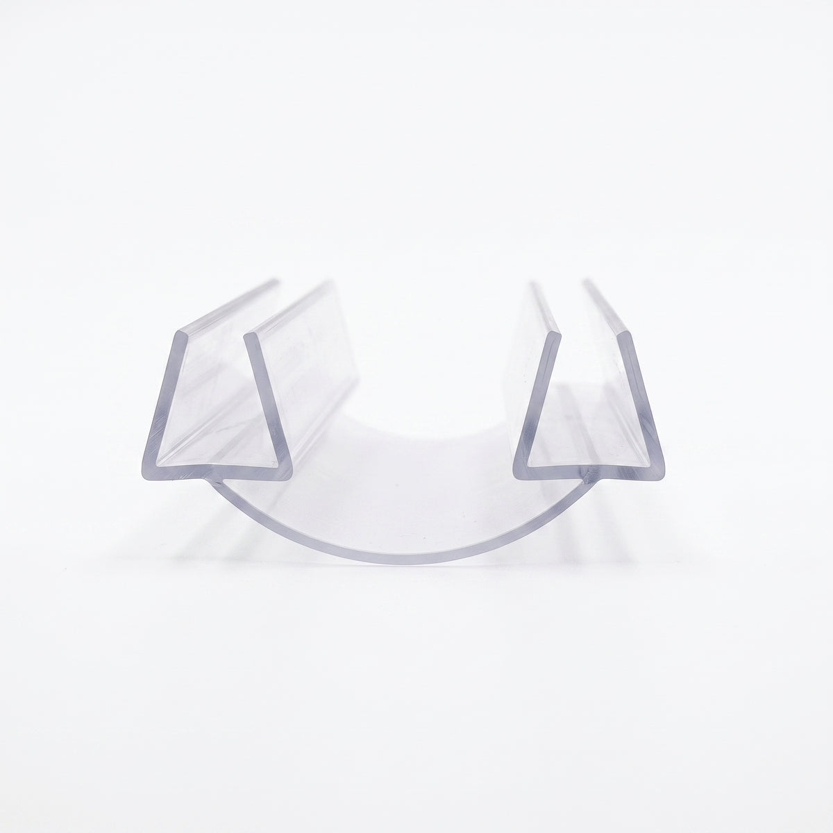 Clear glass-to-glass seal offcut on white, two U channels joined by a curved membrane, end-on view