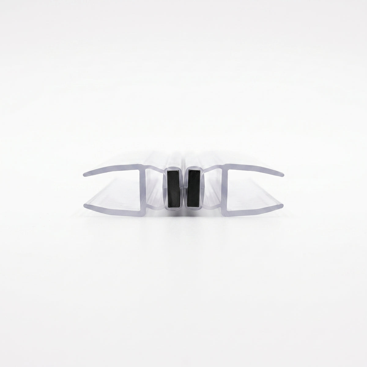 Two clear magnetic seal profiles closed on white, upright black magnets touching face to face, end-on