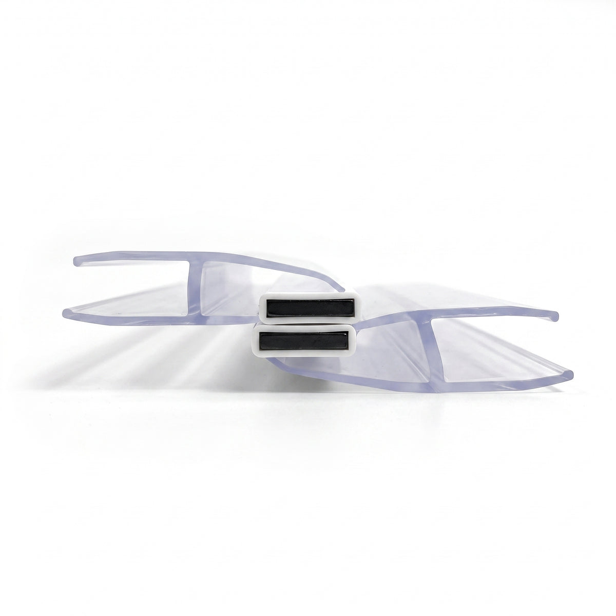 Two clear offset seal profiles overlapping on white, two stacked black magnets meeting between them