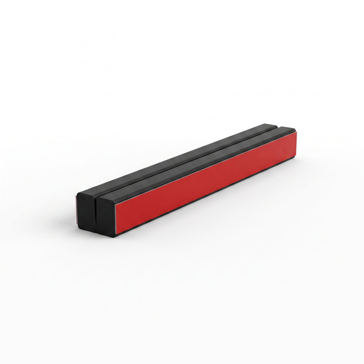 Two black magnetic seal strips snapped together on white, red adhesive tape along the exposed side face