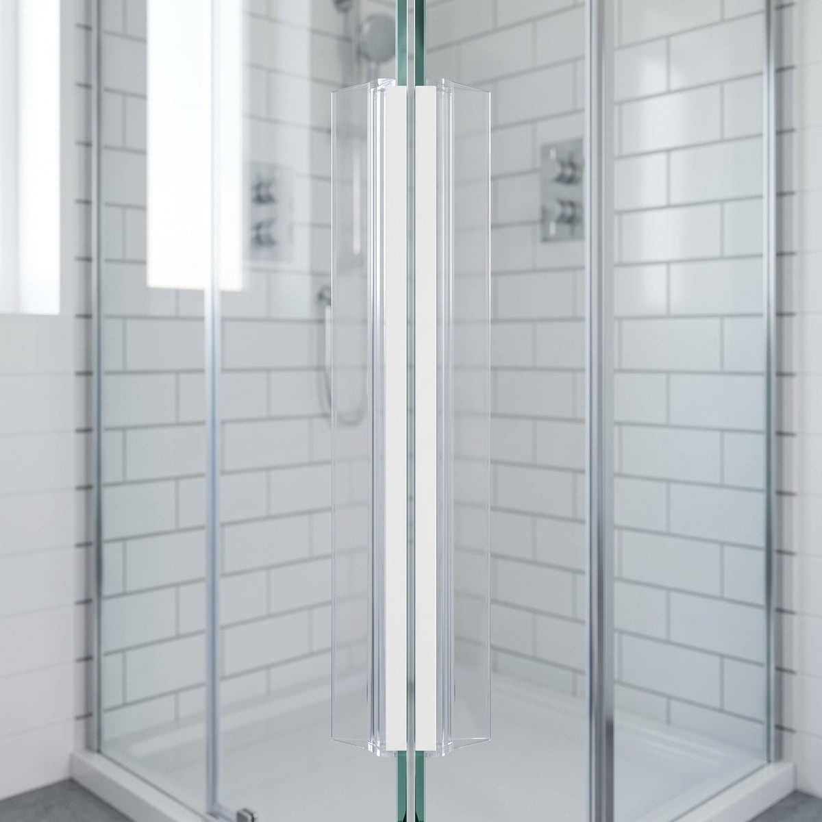 White magnetic seal line running full height where two glass shower doors meet, metro tiles behind