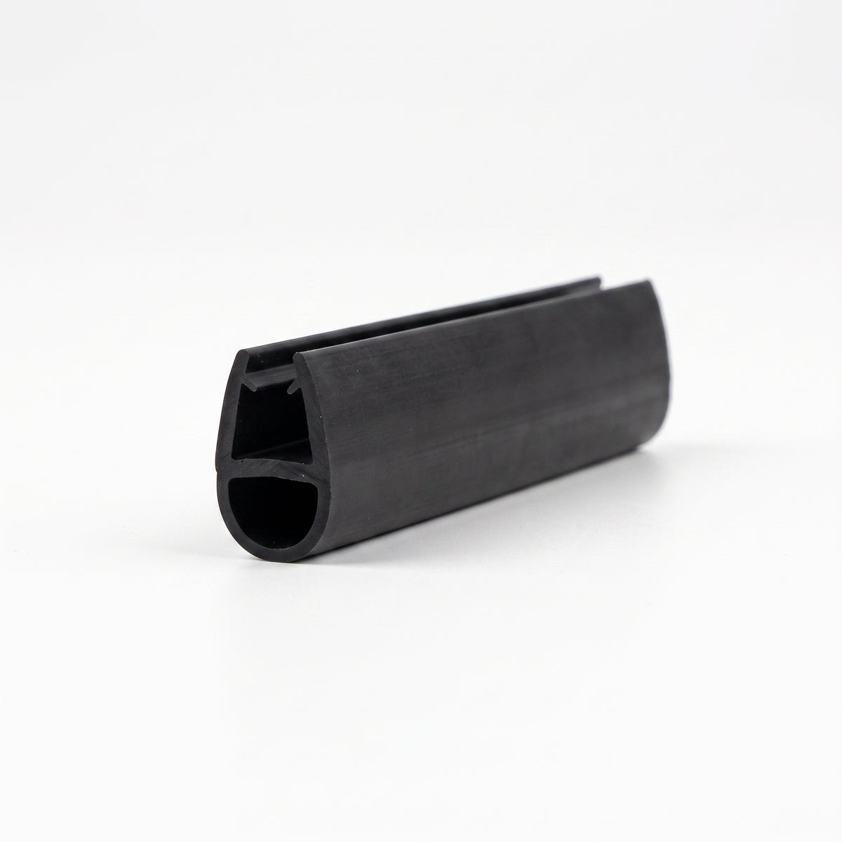 Black seal offcut on white, glass channel above an oval hollow bubble at the cut end