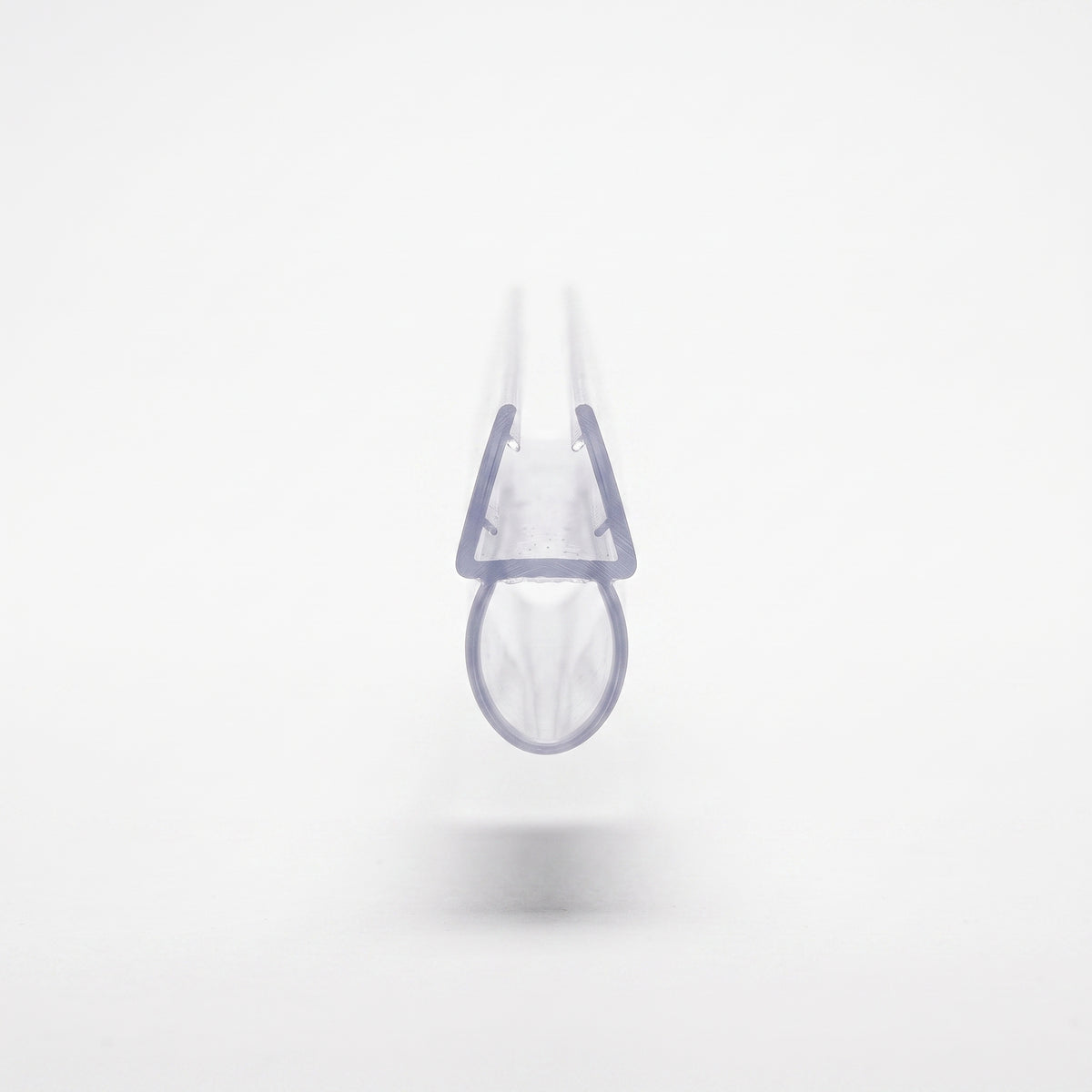 Clear seal offcut end-on on white, small glass channel above a large round hollow bubble