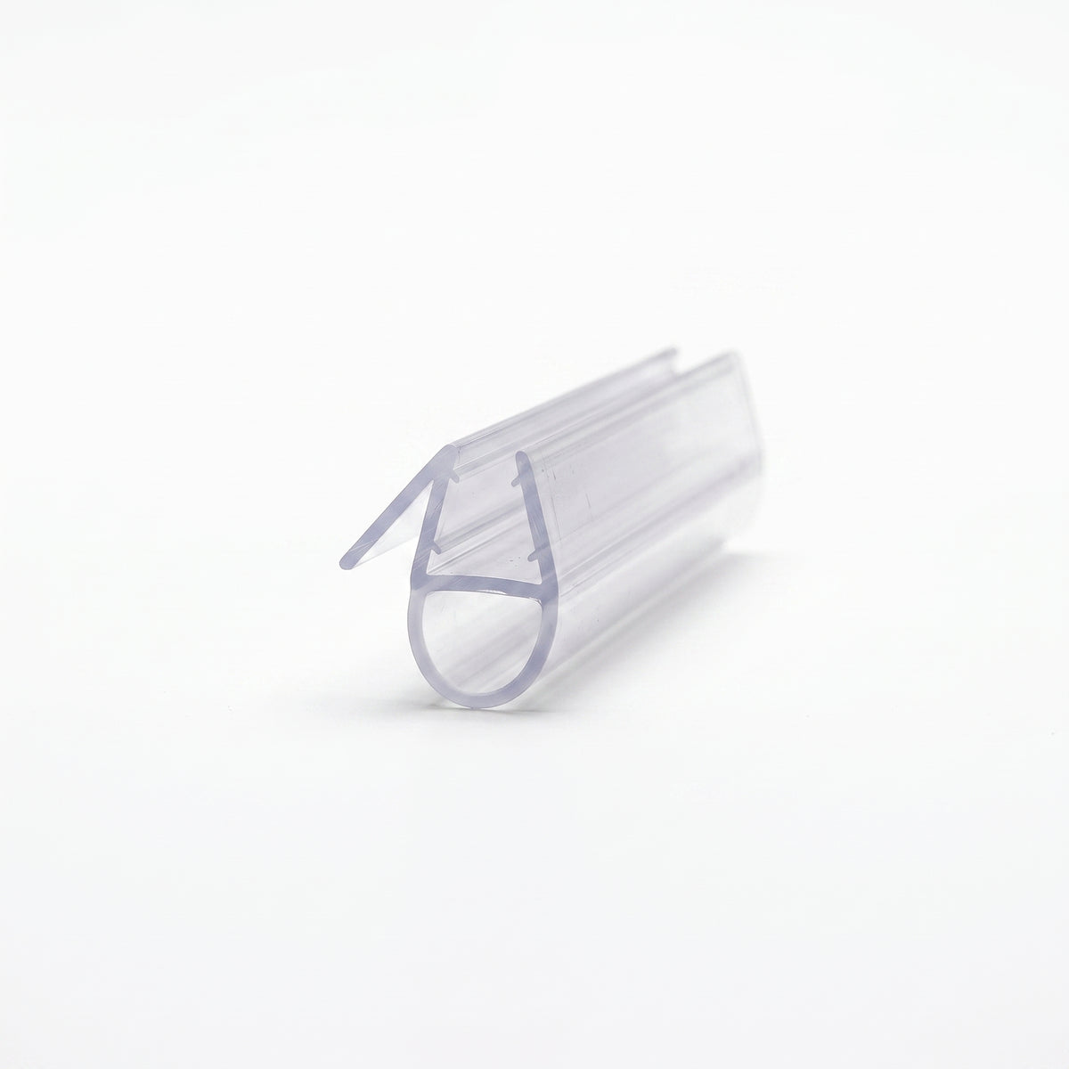 Clear seal offcut angled on white, glass channel with a round hollow bubble and an angled fin