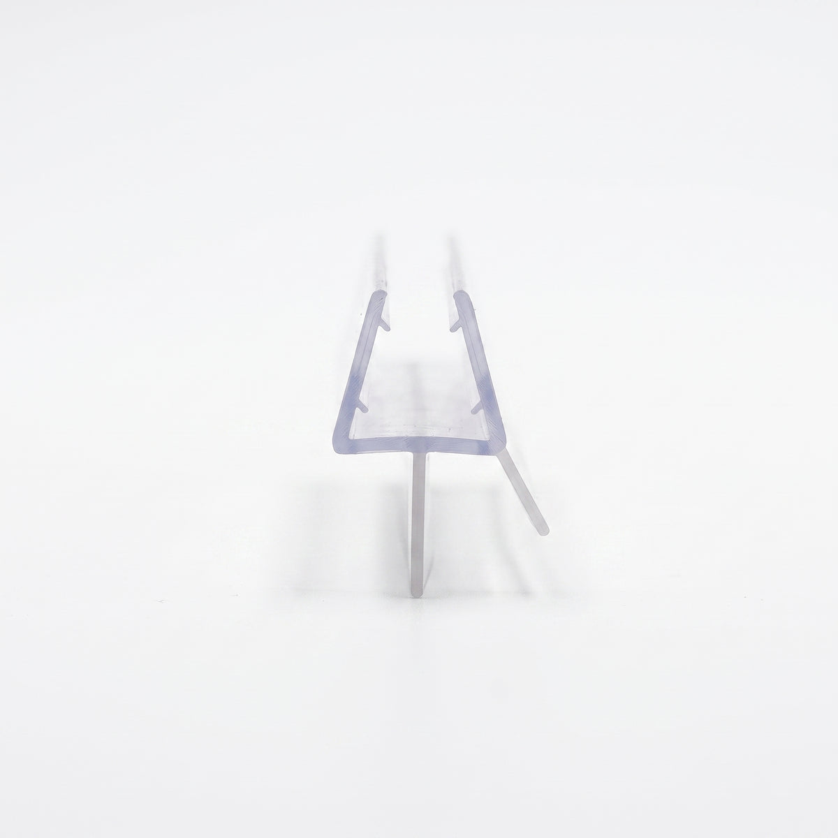 Clear seal offcut end-on on white, glass channel with a long drop blade and a short angled fin