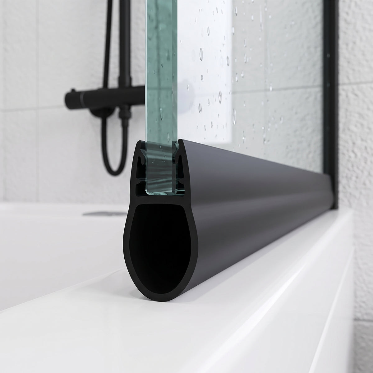 Black bulb seal on the bottom edge of a glass door, resting on a white bath with black fittings