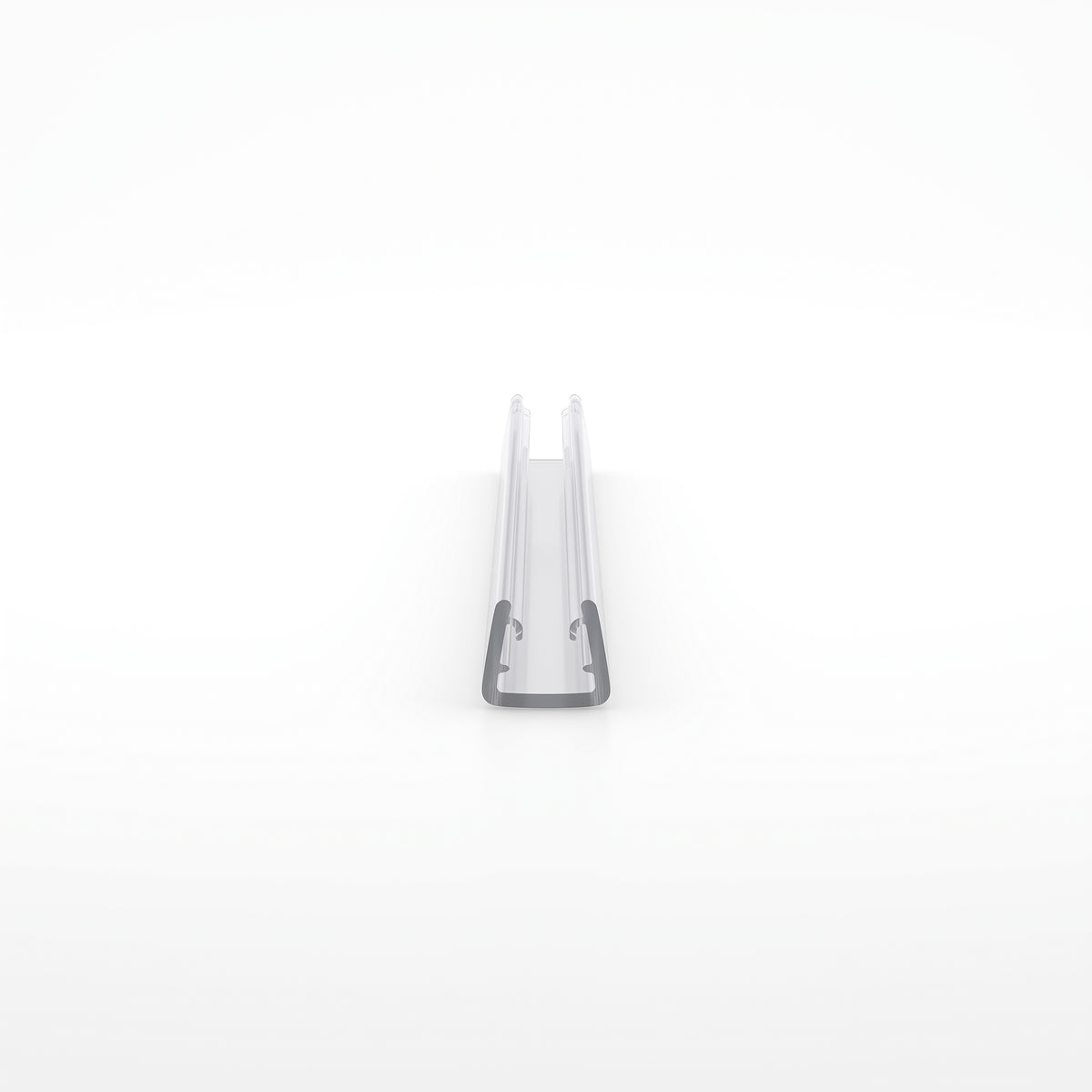 Small clear U-channel offcut end-on on white, plain glass channel with no fin
