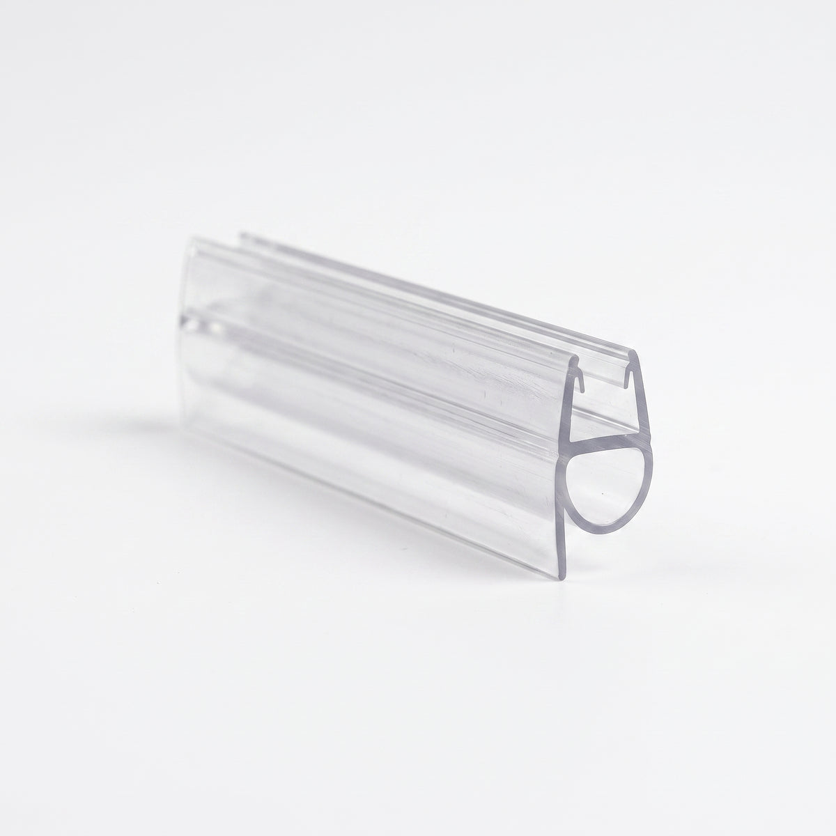 Cut length of clear shower seal on white, angled - glass channel with a round bubble loop on one side