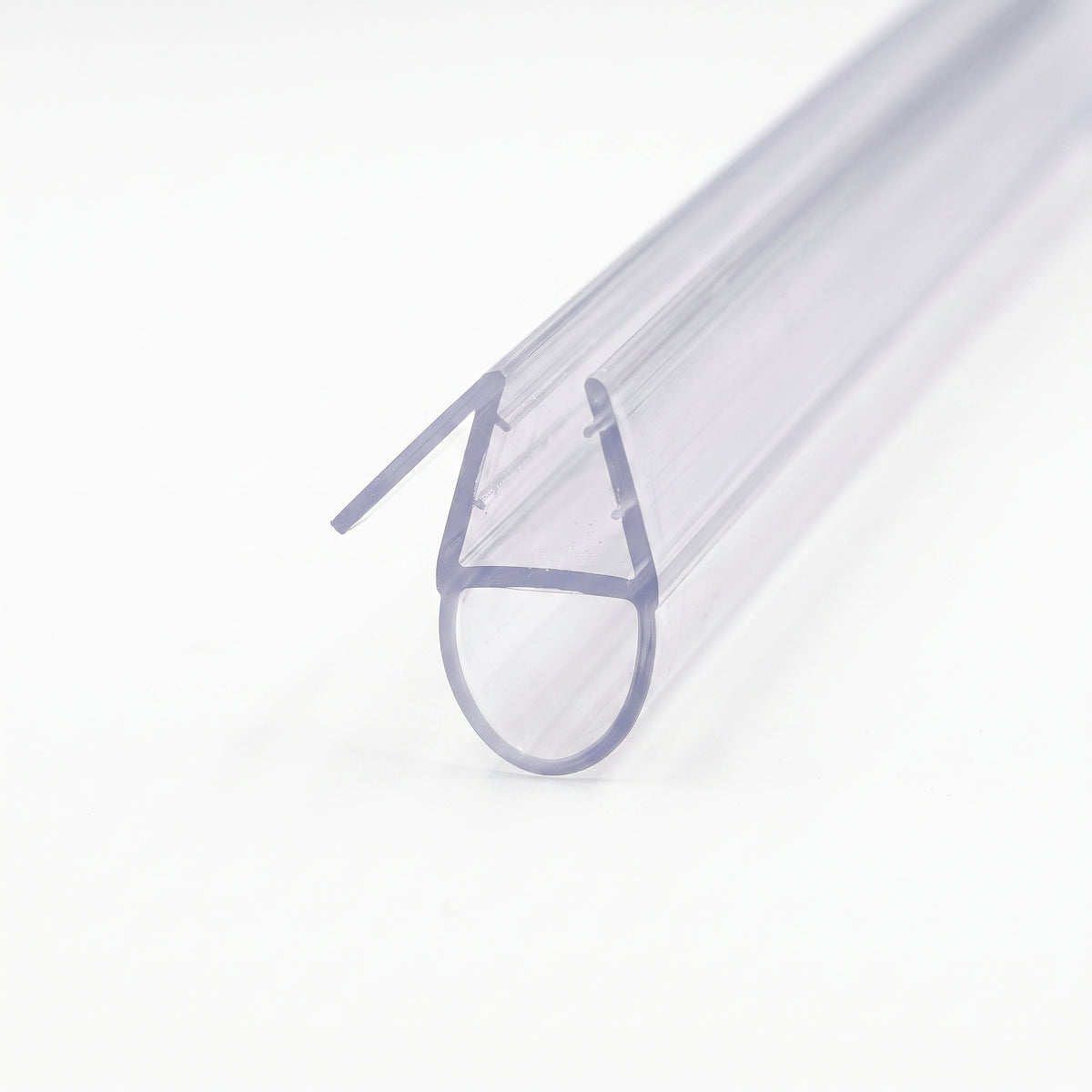 Clear seal on white receding from its cut end, angled rigid fin beside the channel above a large hollow round bubble