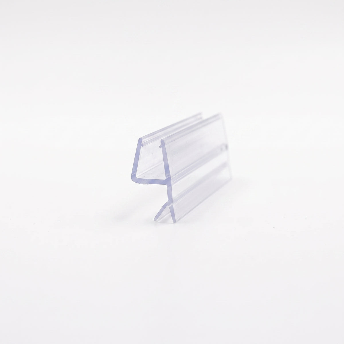 Clear seal offcut on white, angled - glass channel with a rigid angled blade and a soft lower fin